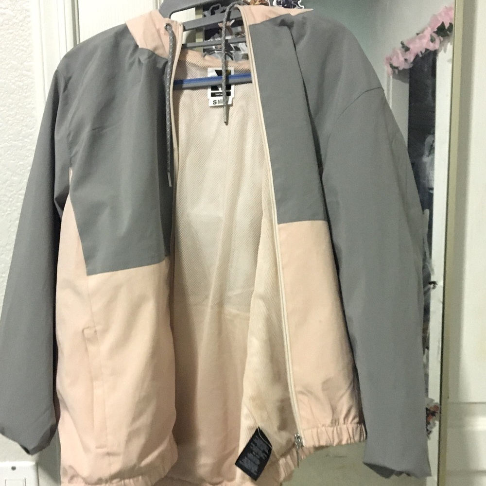 Grey and white wind breaker by voyager